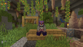 Jacob sitting in a lush cave (2024)